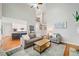 Comfortable living room with hardwood floors, an open layout, and access to the kitchen at 1335 Joy Ct, Suwanee, GA 30024