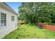 Expansive backyard with lush greenery and ample space for outdoor activities at 1732 Winding Woods Ln, Jonesboro, GA 30236