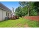 Spacious backyard featuring a wooden deck and partial privacy fence at 1732 Winding Woods Ln, Jonesboro, GA 30236