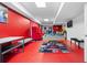 Finished basement offers a pool table, red walls, and a stylish rug at 1732 Winding Woods Ln, Jonesboro, GA 30236