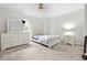 Bright bedroom featuring white furniture, neutral walls, and a serene ambiance at 1732 Winding Woods Ln, Jonesboro, GA 30236