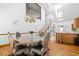 Open concept dining area with chandelier, open staircase and bar seating at 1732 Winding Woods Ln, Jonesboro, GA 30236