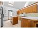 Well-lit kitchen features an island, abundant cabinetry, and lots of countertop space at 1732 Winding Woods Ln, Jonesboro, GA 30236