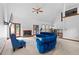 Open-concept living room with high ceilings, fireplace, and a large window view at 1732 Winding Woods Ln, Jonesboro, GA 30236