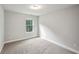 Bedroom with carpet floor, window and neutral paint at 176 Windy Cir, Mcdonough, GA 30253