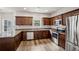 Modern kitchen with stainless steel appliances, granite countertops, hardwood floors, and ample cabinet space at 176 Windy Cir, Mcdonough, GA 30253