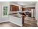 Well-equipped kitchen featuring stainless steel appliances, granite countertops, and breakfast bar, perfect for casual dining at 176 Windy Cir, Mcdonough, GA 30253