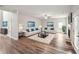 Spacious living room with modern decor, hardwood floors, fireplace, and ample natural light perfect for entertaining at 176 Windy Cir, Mcdonough, GA 30253