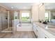 Elegant bathroom featuring a shower, tub, and double vanity with granite countertops at 2039 West Hampton Dr, Canton, GA 30115