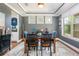 Formal dining room with tray ceiling, hardwood floors, and a large window view at 2039 West Hampton Dr, Canton, GA 30115