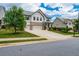 Beautiful two-story home with a well-manicured lawn and a long driveway at 2039 West Hampton Dr, Canton, GA 30115