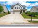 Charming two-story house with a three-car garage, well-manicured lawn, and beautiful landscaping at 2039 West Hampton Dr, Canton, GA 30115