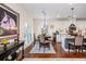 A modern kitchen with stainless steel appliances, granite countertops, and an adjacent dining area at 2039 West Hampton Dr, Canton, GA 30115