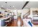 Bright, open-concept living area flowing from the kitchen and featuring a staircase at 2039 West Hampton Dr, Canton, GA 30115