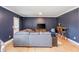 Inviting living room features a comfortable gray sectional sofa and stylish bar area with seating at 2039 West Hampton Dr, Canton, GA 30115