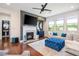 Cozy living room features a fireplace, plush seating, a view of the windows, and a powder room at 2039 West Hampton Dr, Canton, GA 30115