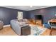 Inviting living room features a comfortable gray sectional sofa and stylish bar area with seating at 2039 West Hampton Dr, Canton, GA 30115