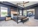 Stylish main bedroom boasts a four-poster bed, en suite exercise area, and elegant design at 2039 West Hampton Dr, Canton, GA 30115
