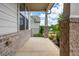 Covered front porch with brick pillars, offering a welcoming entrance at 2039 West Hampton Dr, Canton, GA 30115