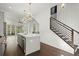 Bright kitchen featuring an island, stainless steel appliances, and modern lighting fixtures at 2335 Mason Dr # D27, Atlanta, GA 30316