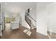 Bright kitchen with hardwood floors, stainless steel appliances, and a modern staircase at 2335 Mason Dr # D27, Atlanta, GA 30316