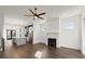 Open floor plan with a fireplace, ceiling fan, hardwood floors, and eat-in kitchen at 2335 Mason Dr # D27, Atlanta, GA 30316