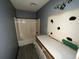 Bathroom with vanity and shower-tub combo featuring a unique light fixture at 2612 Ramblewood Ct, Acworth, GA 30102