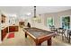 Finished basement with pool table, fireplace, and sitting area at 1170 Spring Oak Way, Cumming, GA 30041