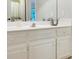 Bright bathroom with white cabinets and single basin vanity at 1170 Spring Oak Way, Cumming, GA 30041