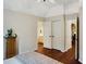 Bright bedroom features hardwood floors, a ceiling fan, and access to an en-suite bathroom at 1170 Spring Oak Way, Cumming, GA 30041