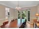 Spacious dining room showcasing a chandelier and picturesque window views at 1170 Spring Oak Way, Cumming, GA 30041