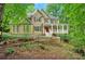 Inviting home with a charming porch and landscaped front yard at 1170 Spring Oak Way, Cumming, GA 30041