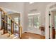 Elegant foyer with hardwood floors and double doors leading to outdoor scenery at 1170 Spring Oak Way, Cumming, GA 30041