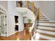 Grand foyer featuring hardwood floors, iron-wrought banister, and an open floor plan at 1170 Spring Oak Way, Cumming, GA 30041