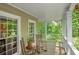 Cozy front porch with rocking chairs, perfect for enjoying the peaceful scenery and the natural surroundings at 1170 Spring Oak Way, Cumming, GA 30041