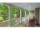 Spacious front porch with rocking chairs, providing a relaxing outdoor space with views of the surrounding greenery at 1170 Spring Oak Way, Cumming, GA 30041
