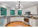 Charming kitchen with granite countertops, stainless steel appliances, and hardwood floors at 1170 Spring Oak Way, Cumming, GA 30041