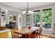 Open kitchen layout featuring hardwood floors, granite countertops, and access to the deck at 1170 Spring Oak Way, Cumming, GA 30041