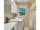 Functional laundry room with washer, dryer, ample cabinet space, and natural light at 1170 Spring Oak Way, Cumming, GA 30041