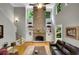 Spacious living room with soaring ceilings, stone fireplace, and hardwood floors at 1170 Spring Oak Way, Cumming, GA 30041