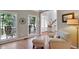Bright living room with hardwood floors, large windows, and a relaxing seating area at 1170 Spring Oak Way, Cumming, GA 30041