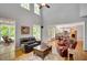 Spacious living room with high ceilings and natural light, seamlessly connecting to the modern kitchen and outdoor living at 1170 Spring Oak Way, Cumming, GA 30041