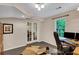 Home office featuring carpet flooring, natural light and double doors at 1170 Spring Oak Way, Cumming, GA 30041