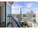 City views and skyline are featured from this condo balcony with view of pool and green spaces at 3324 Peachtree Ne Rd # 2518, Atlanta, GA 30326