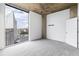 Bedroom featuring city views from the large windows and neutral carpet at 3324 Peachtree Ne Rd # 2518, Atlanta, GA 30326