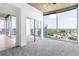 Bedroom featuring floor to ceiling windows that look out over the cityscape and neutral carpet at 3324 Peachtree Ne Rd # 2518, Atlanta, GA 30326