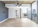 Spacious bedroom with hardwood floors, a ceiling fan, and large windows offering stunning city views at 3324 Peachtree Ne Rd # 2518, Atlanta, GA 30326