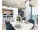 Dining room with seating for six with kitchen in the background and city views at 3324 Peachtree Ne Rd # 2518, Atlanta, GA 30326