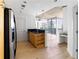 Open concept kitchen with island and stainless appliances and access to living room and views at 3324 Peachtree Ne Rd # 2518, Atlanta, GA 30326