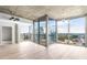 Bright living room featuring hardwood floors, ceiling fan, and floor-to-ceiling windows with a city view at 3324 Peachtree Ne Rd # 2518, Atlanta, GA 30326